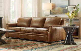 At 92.5 inches, Hooker Furniture?s Yates sofa doesn?t skimp on scale, but a slightly curved front rail gives a modern take on traditional styling. Natural waxed leather adds a rugged element to the transitional look.