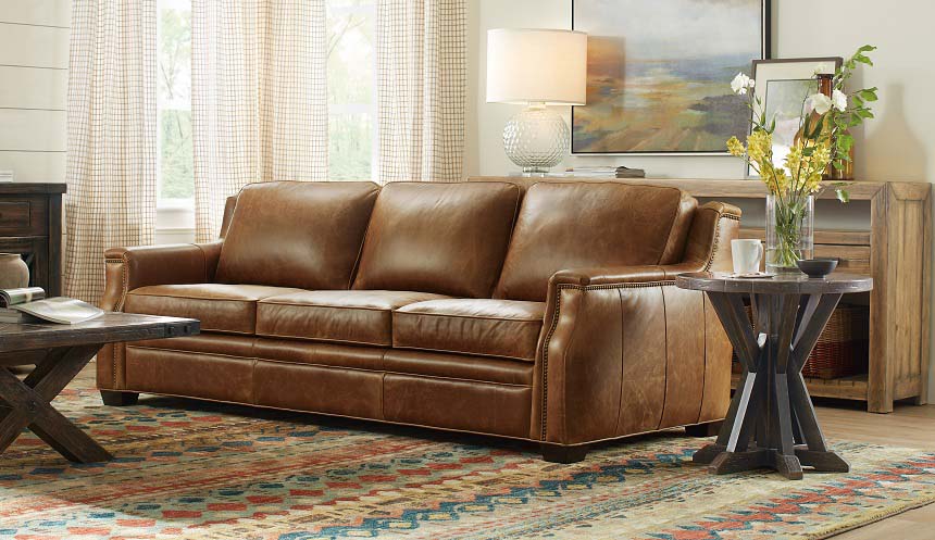 At 92.5 inches, Hooker Furniture’s Yates sofa doesn’t skimp on scale, but a slightly curved front rail gives a modern take on traditional styling. Natural waxed leather adds a rugged element to the transitional look.