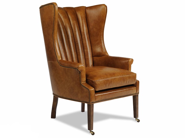 Shown here with casters, the sleek Philosopher wing chair from Taylor King’s Lauren Liess collection also comes with plain feet to avoid scratching wood or tile floors.