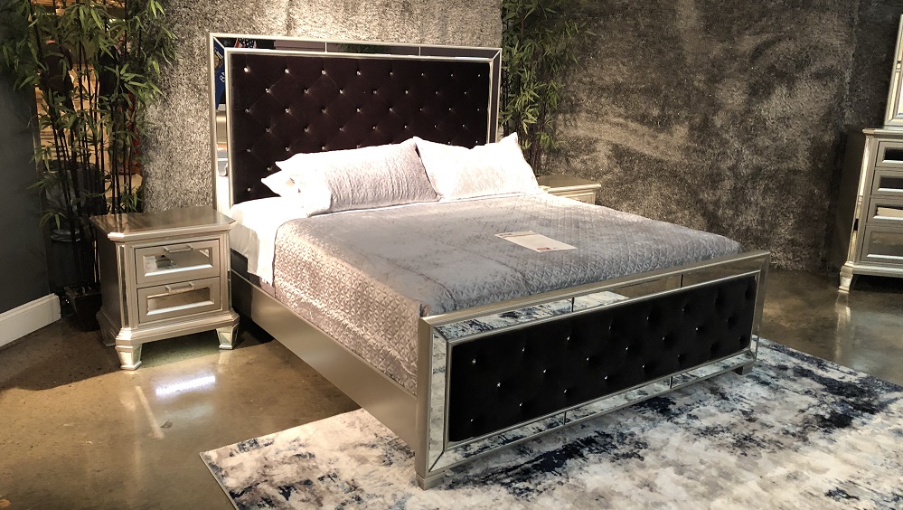 Glam design elements including mirrored accents define the styling of this bedroom set by Ashley. 