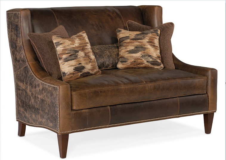 The Lavendar settee from Bradington-Young is shown a new chocolate novelty leather with rich cognac and tawny hues complemented with intricate nailhead details.
